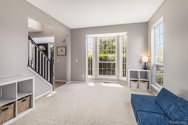 1122 Colt Dr, South Lyon, MI 48178 - carpeted foyer entrance featuring baseboards and stairs