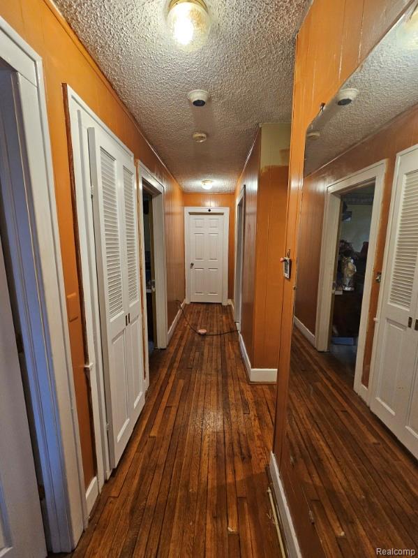 2036 Collingwood St, Detroit, MI 48206 - corridor with dark wood-style floors and a textured ceiling