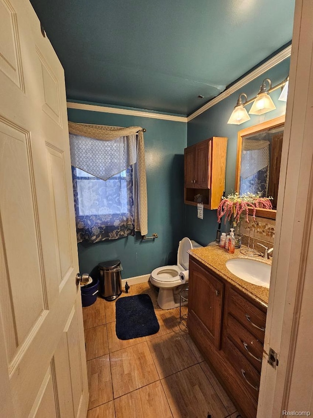 2036 Collingwood St, Detroit, MI 48206 - half bath with vanity, toilet, crown molding, and wood finished floors