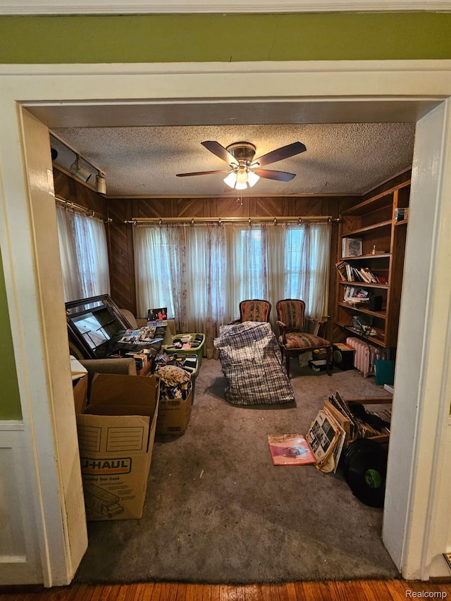 2036 Collingwood St, Detroit, MI 48206 - living area featuring a textured ceiling, ceiling fan, and carpet floors