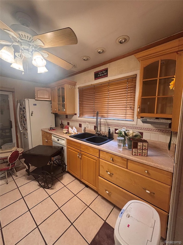 2036 Collingwood St, Detroit, MI 48206 - kitchen featuring a sink, freestanding refrigerator, light tile patterned floors, a ceiling fan, and light countertops