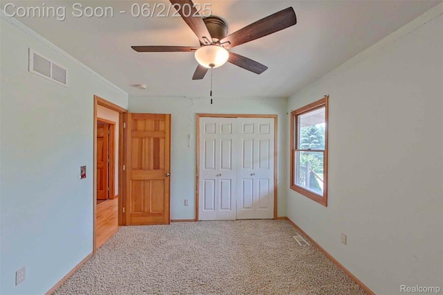 3749 Chase Lake Rd, Howell, MI 48855 - unfurnished bedroom featuring light carpet, a closet, and baseboards