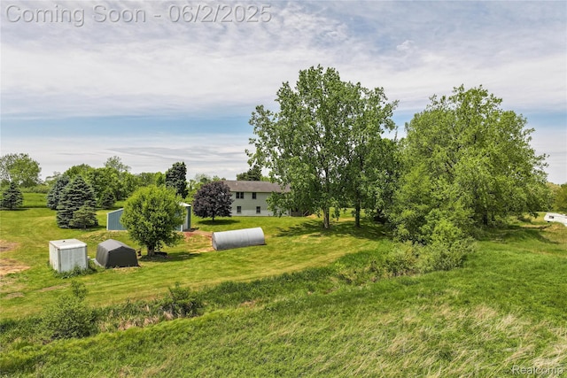 3749 Chase Lake Rd, Howell, MI 48855 - view of green lawn with an outdoor structure