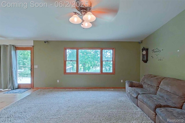3749 Chase Lake Rd, Howell, MI 48855 - carpeted living area with ceiling fan and baseboards