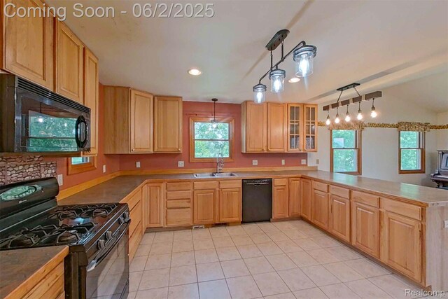 3749 Chase Lake Rd, Howell, MI 48855 - kitchen with black appliances, a sink, a peninsula, light tile patterned flooring, and light brown cabinetry