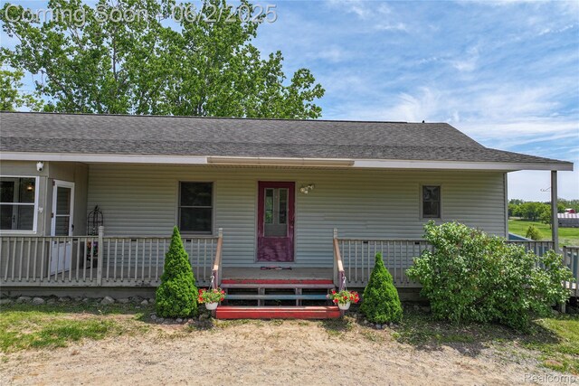 3749 Chase Lake Rd, Howell, MI 48855 - view of front of property with roof with shingles and covered porch