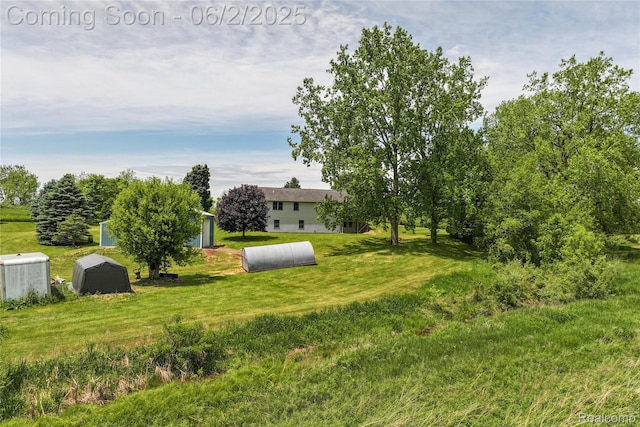 3749 Chase Lake Rd, Howell, MI 48855 - view of grassy yard with an outbuilding
