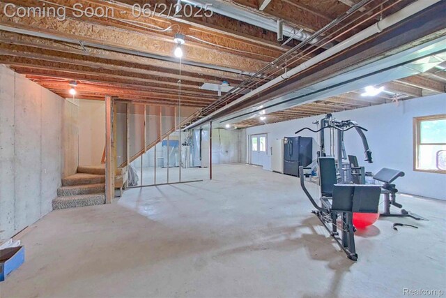 3749 Chase Lake Rd, Howell, MI 48855 - below grade area featuring stairway and plenty of natural light