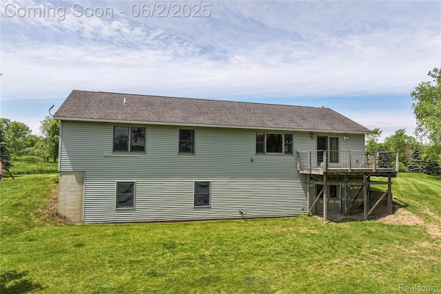3749 Chase Lake Rd, Howell, MI 48855 - back of house with a deck, a lawn, and a shingled roof