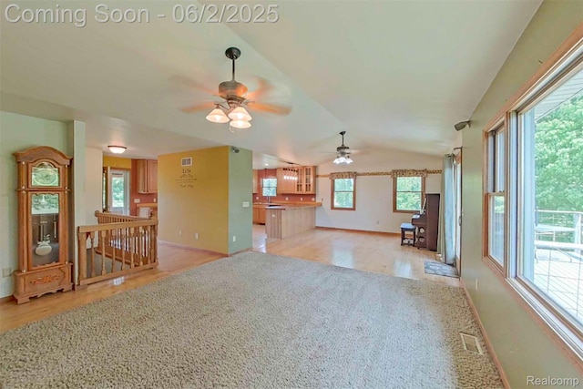 3749 Chase Lake Rd, Howell, MI 48855 - unfurnished living room with ceiling fan, baseboards, light wood-type flooring, and lofted ceiling