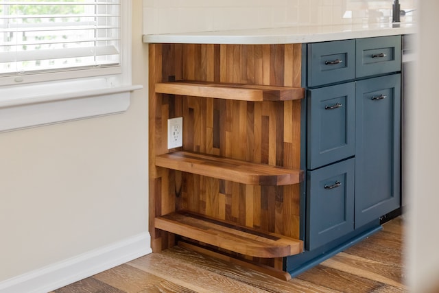 detailed view of wood finished floors and baseboards