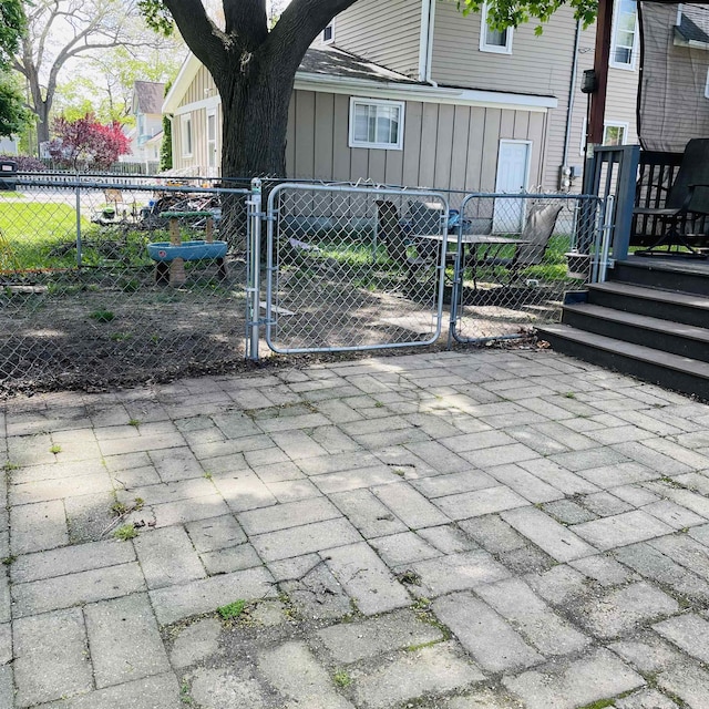 326 N Oak St, Owosso, MI 48867 - view of patio featuring a gate and fence