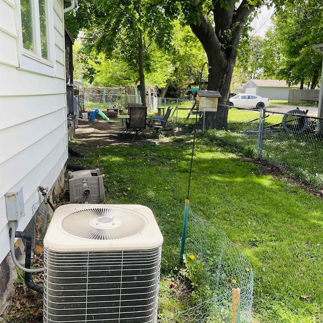 326 N Oak St, Owosso, MI 48867 - exterior view of central AC unit and a fenced backyard