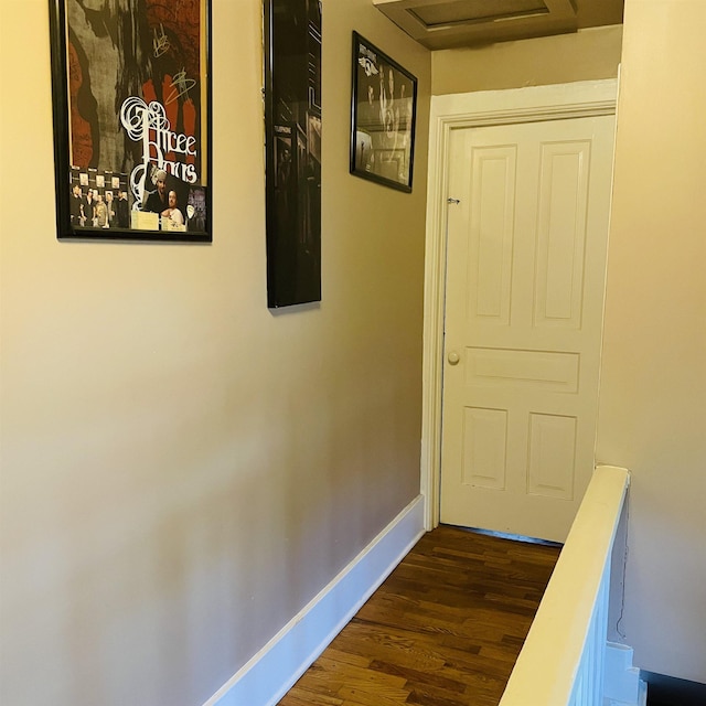 326 N Oak St, Owosso, MI 48867 - hall featuring dark wood-style flooring, baseboards, and attic access