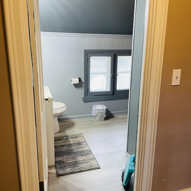 326 N Oak St, Owosso, MI 48867 - bathroom featuring wood finished floors, toilet, and baseboards