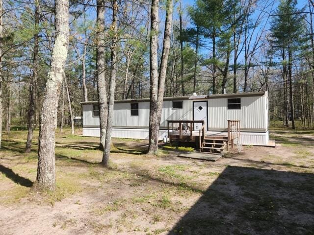 1631 W Lone Pine Rd, Baldwin, MI 49304 - view of front of property with a deck