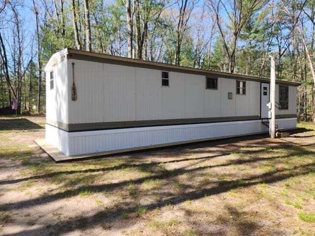 1631 W Lone Pine Rd, Baldwin, MI 49304 - view of home's exterior featuring view of scattered trees