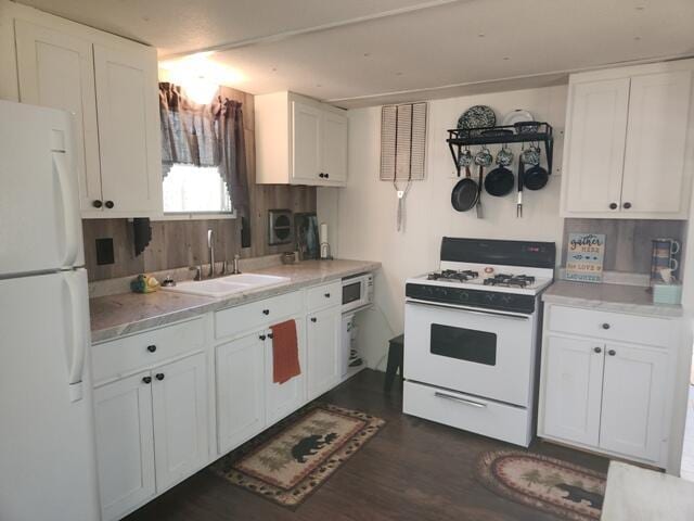 1631 W Lone Pine Rd, Baldwin, MI 49304 - kitchen with white appliances, a sink, and white cabinetry