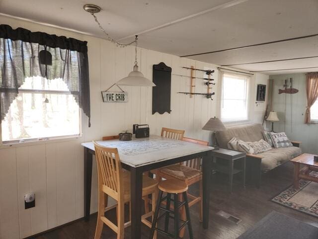 1631 W Lone Pine Rd, Baldwin, MI 49304 - dining area featuring dark wood-type flooring