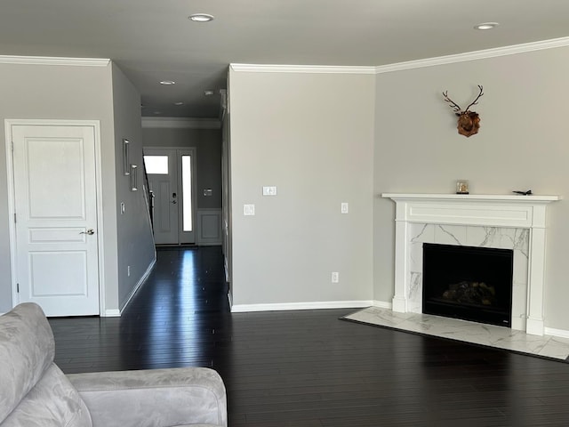 31065 Tremont Ln, Franklin, MI 48025 - living area featuring baseboards, ornamental molding, dark wood-style flooring, recessed lighting, and a high end fireplace