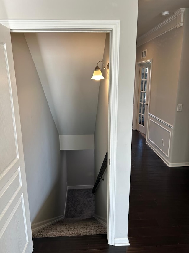 31065 Tremont Ln, Franklin, MI 48025 - stairway featuring wood finished floors, baseboards, and ornamental molding