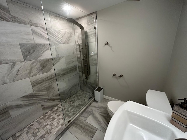31065 Tremont Ln, Franklin, MI 48025 - full bath with toilet, a stall shower, marble finish floors, and baseboards