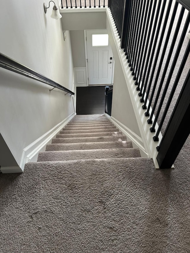 31065 Tremont Ln, Franklin, MI 48025 - stairs featuring baseboards and carpet floors