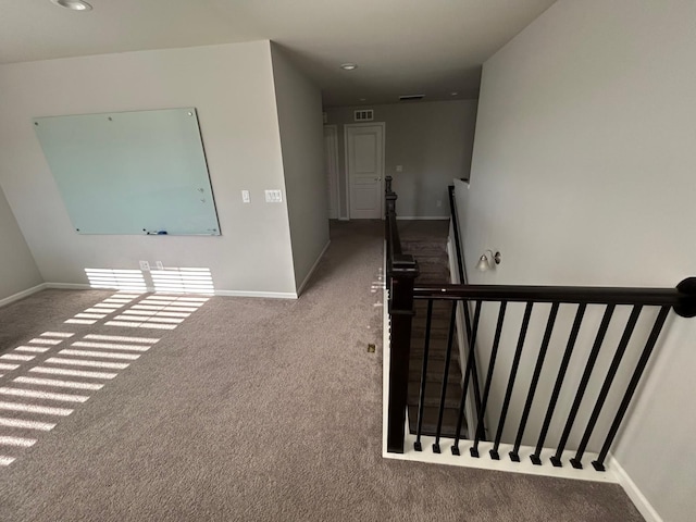 31065 Tremont Ln, Franklin, MI 48025 - hallway with an upstairs landing, carpet flooring, baseboards, and recessed lighting