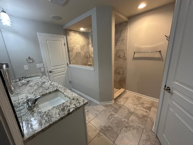 31065 Tremont Ln, Franklin, MI 48025 - full bathroom with marble look tile flooring, a walk in shower, baseboards, double vanity, and recessed lighting