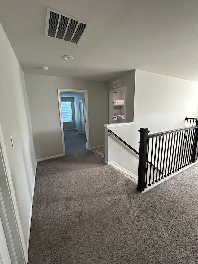 31065 Tremont Ln, Franklin, MI 48025 - hallway featuring an upstairs landing, carpet, baseboards, and recessed lighting