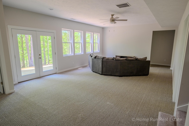 8828 Division Ave S, Byron Center, MI 49315 - living area with carpet flooring, baseboards, ceiling fan, and french doors