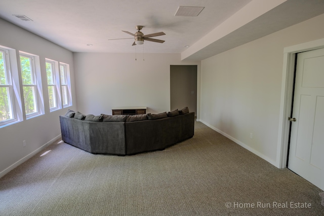 8828 Division Ave S, Byron Center, MI 49315 - living area with carpet floors, baseboards, and ceiling fan