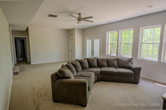 8828 Division Ave S, Byron Center, MI 49315 - living area with carpet floors, a ceiling fan, plenty of natural light, and baseboards