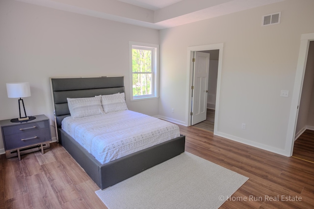 8828 Division Ave S, Byron Center, MI 49315 - bedroom with baseboards and wood finished floors