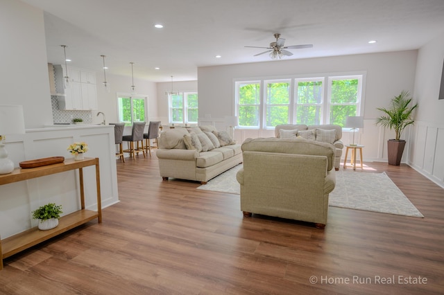 8828 Division Ave S, Byron Center, MI 49315 - living room with ceiling fan, wood finished floors, recessed lighting, and wainscoting