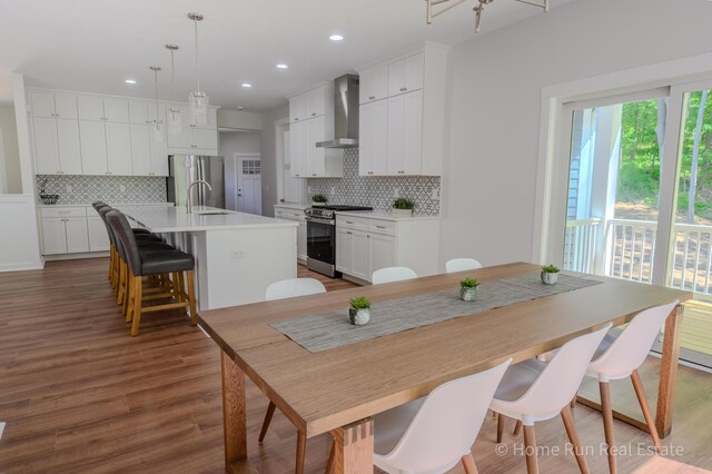 8828 Division Ave S, Byron Center, MI 49315 - dining space featuring wood finished floors and recessed lighting