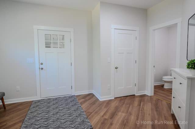 8828 Division Ave S, Byron Center, MI 49315 - foyer featuring wood finished floors and baseboards