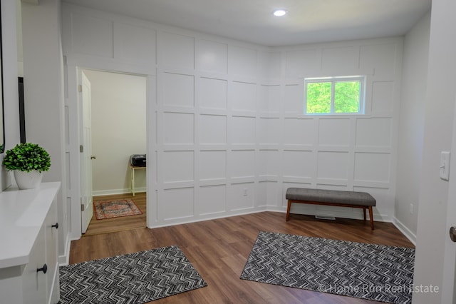 8828 Division Ave S, Byron Center, MI 49315 - unfurnished room with wood finished floors, a decorative wall, and recessed lighting