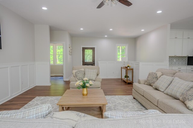 8828 Division Ave S, Byron Center, MI 49315 - living area with a decorative wall, light wood finished floors, wainscoting, ceiling fan, and recessed lighting
