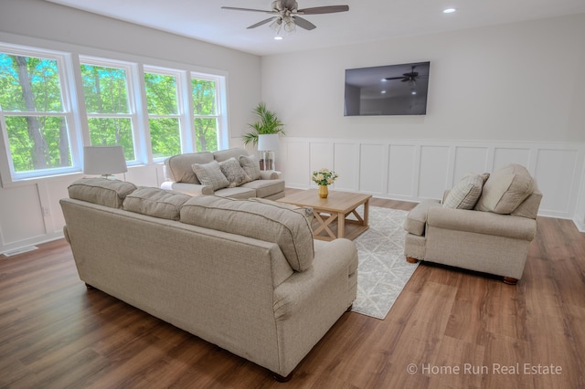 8828 Division Ave S, Byron Center, MI 49315 - living area with a ceiling fan, wainscoting, wood finished floors, a decorative wall, and recessed lighting