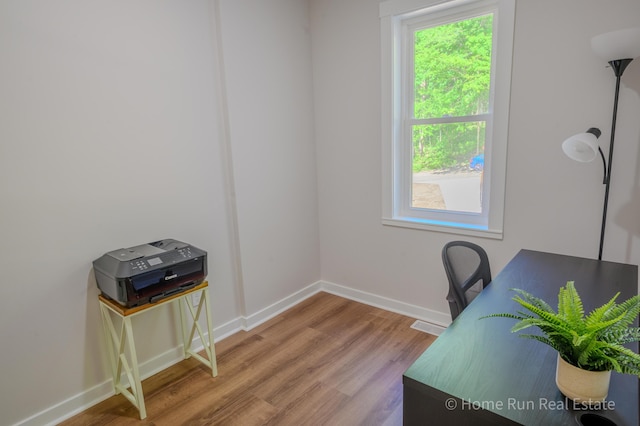 8828 Division Ave S, Byron Center, MI 49315 - home office with wood finished floors and baseboards