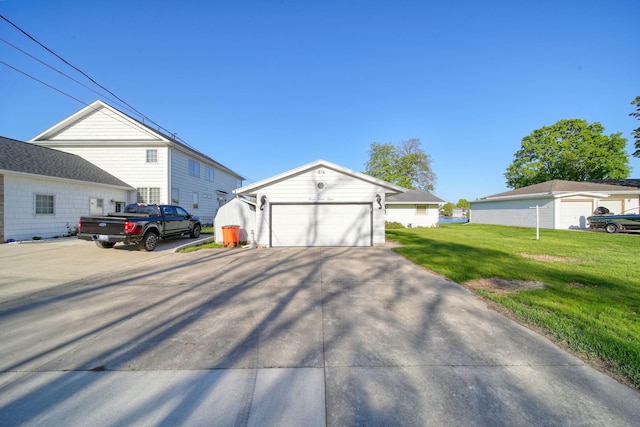 555 S Lakeside Dr, Michigan Center, MI 49254 - view of front of house with an outbuilding, a garage, and a front yard