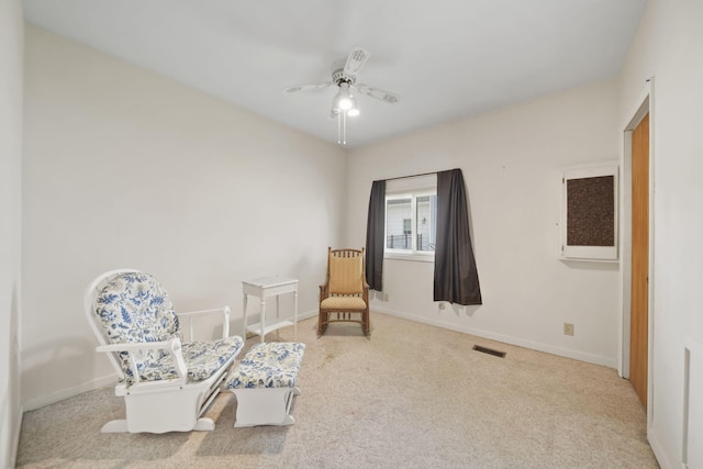 555 S Lakeside Dr, Michigan Center, MI 49254 - sitting room with carpet floors, a ceiling fan, and baseboards