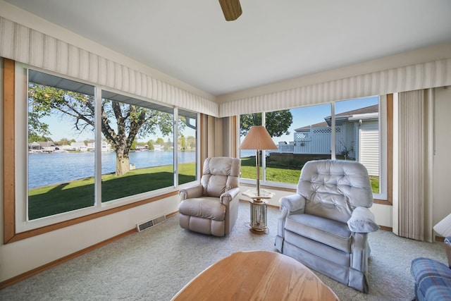 555 S Lakeside Dr, Michigan Center, MI 49254 - sunroom with a water view, carpet flooring, and baseboards