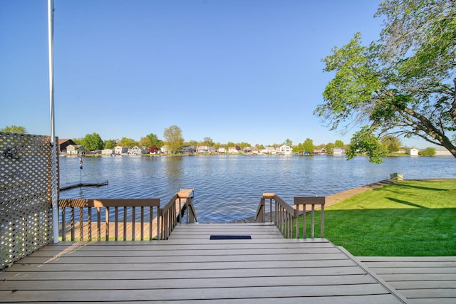 555 S Lakeside Dr, Michigan Center, MI 49254 - dock area with a water view and a lawn