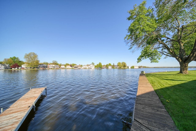 555 S Lakeside Dr, Michigan Center, MI 49254 - dock with a water view and a yard