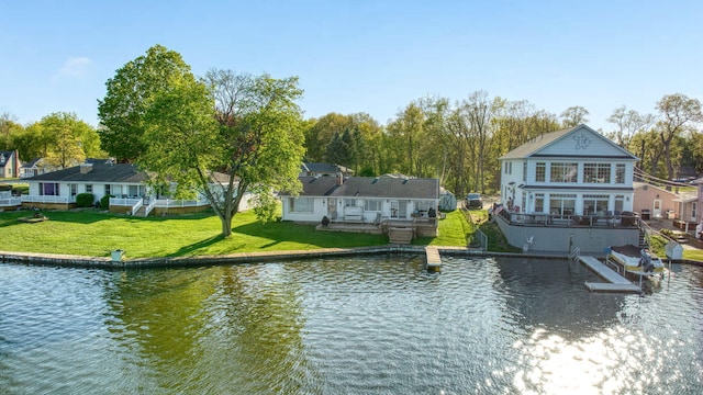 555 S Lakeside Dr, Michigan Center, MI 49254 - water view with a boat dock and nearby suburban area