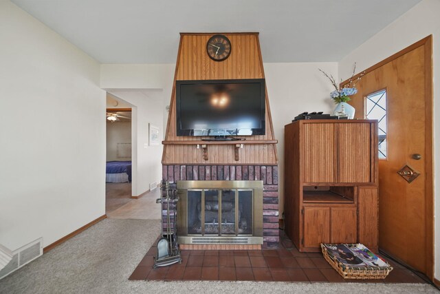 555 S Lakeside Dr, Michigan Center, MI 49254 - living area featuring a ceiling fan, a fireplace, and baseboards