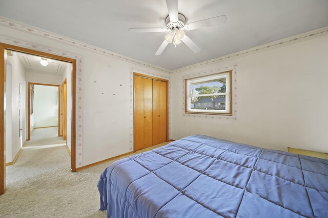 555 S Lakeside Dr, Michigan Center, MI 49254 - bedroom with attic access, light colored carpet, a closet, ceiling fan, and ornamental molding