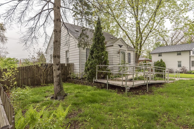 885 Hawthorne Ave, Ypsilanti, MI 48198 - back of property with fence and a shingled roof